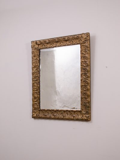 A decorative gilt framed mirror.