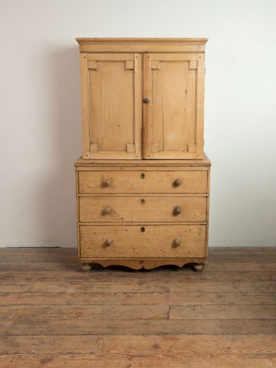 Antique pine cupboard on chest