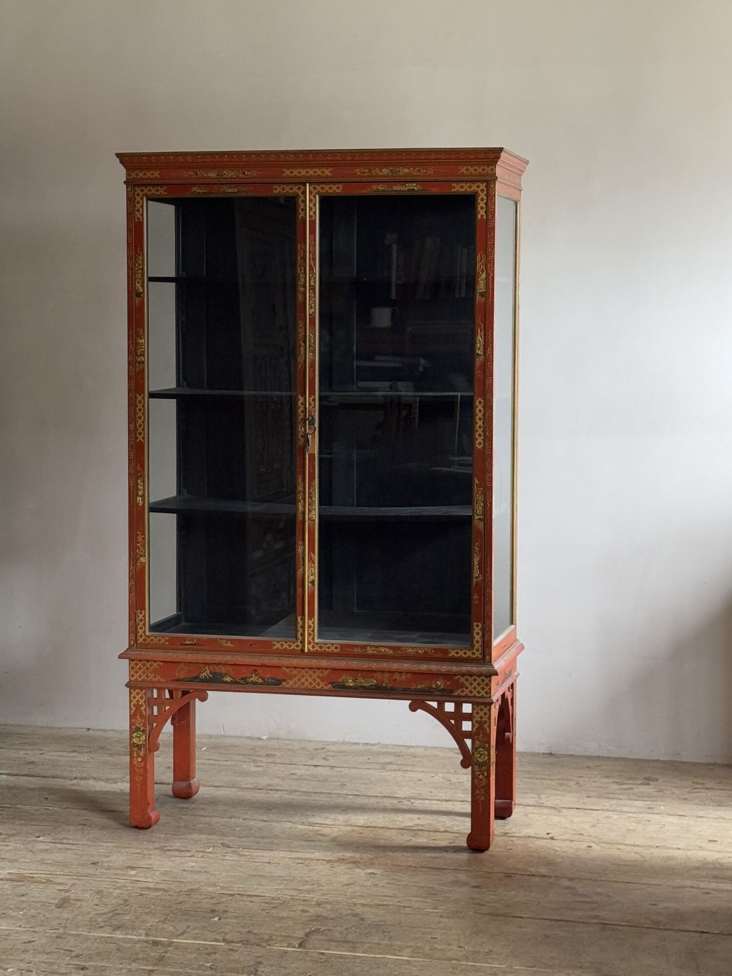 Red lacquered mahogany china cabinet