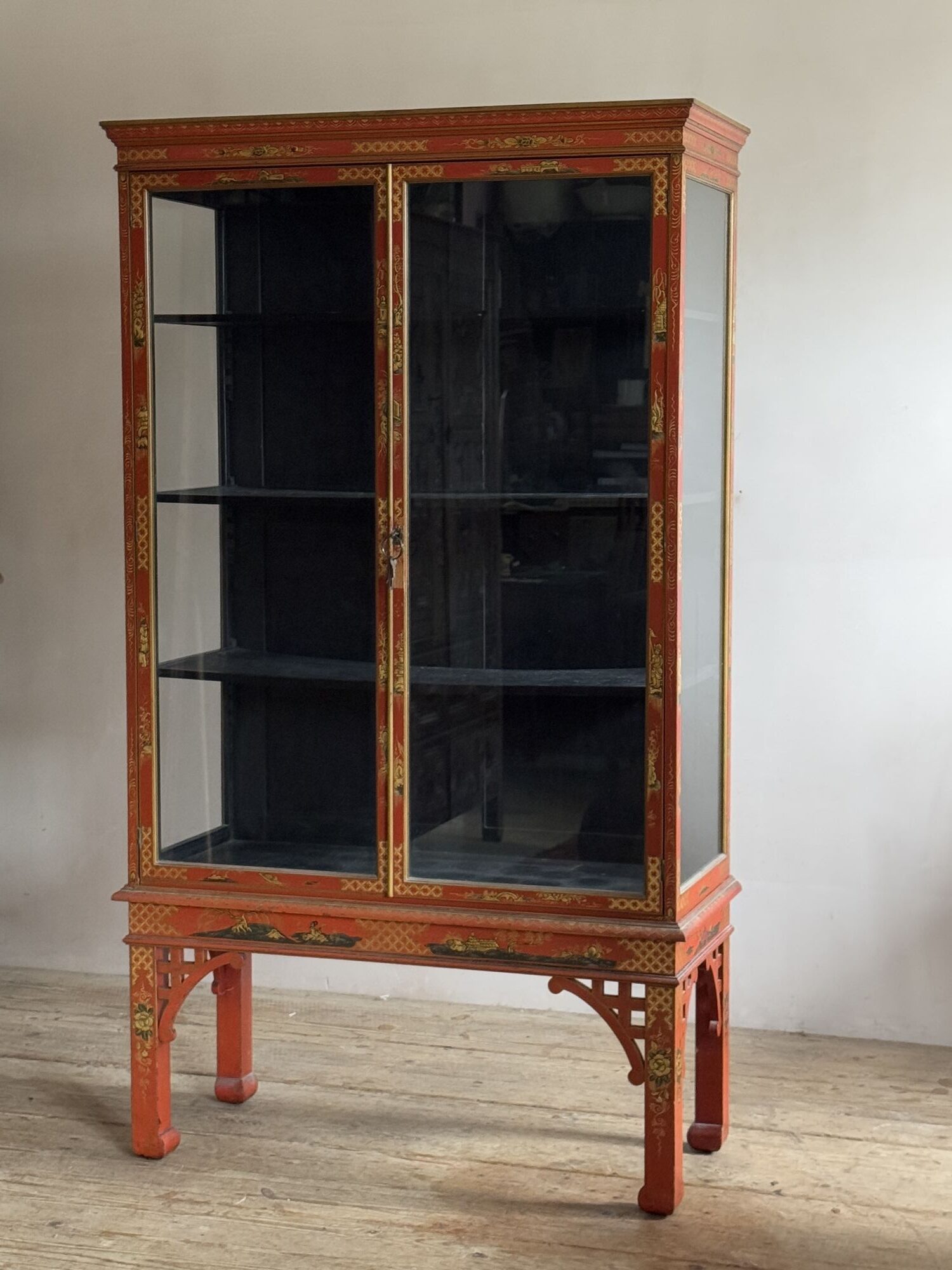 Red lacquered mahogany china cabinet