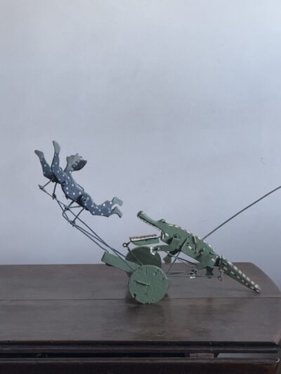Folk art swimmer and crocodile